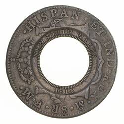 Coin with central hole. Lettering around. Dotted border.