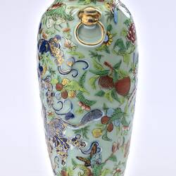 Porcelain vase with all-over pattern of birds, flowers, butterflies and two rats climbing amongst branches.