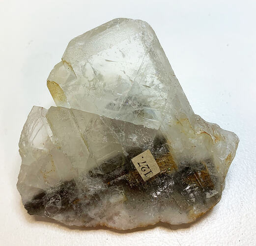 Clear crystal with brown interior in bottom half.