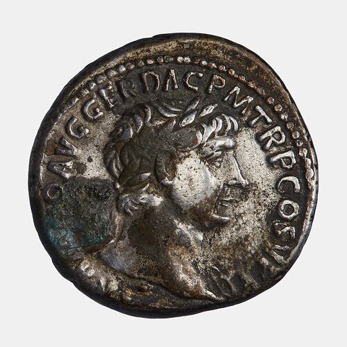 Round coin with male figure facing right. Text around.