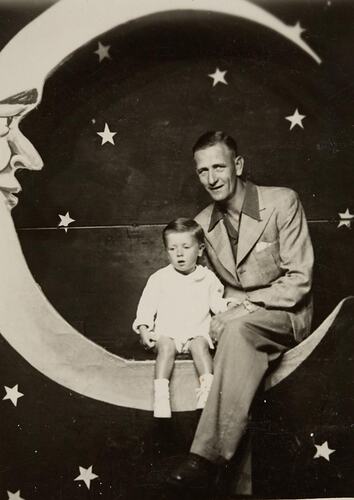 Digital Photograph - Man & Boy on 'Moon'  scenic backdrop, Melbourne, 1942
