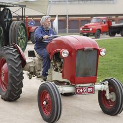 Volunteer driving Chamberlain Prototype Light Tractor at Machinery in Action Show