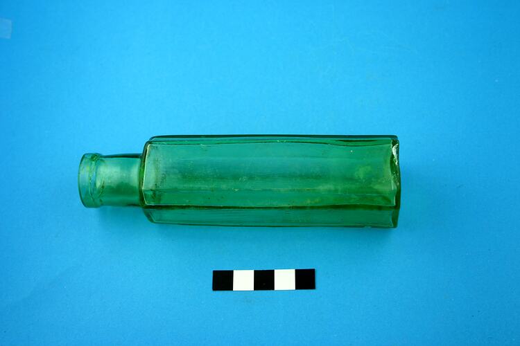 Green glass bottle.