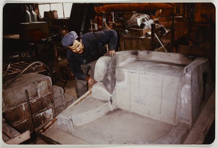 Worker attending to a sand mould, Melbourne, circa 1980