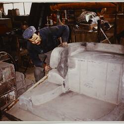 Photograph - Worker attending to a sand mould, Melbourne, circa 1980