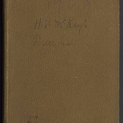 Front cover of a brown book with some faded writing.