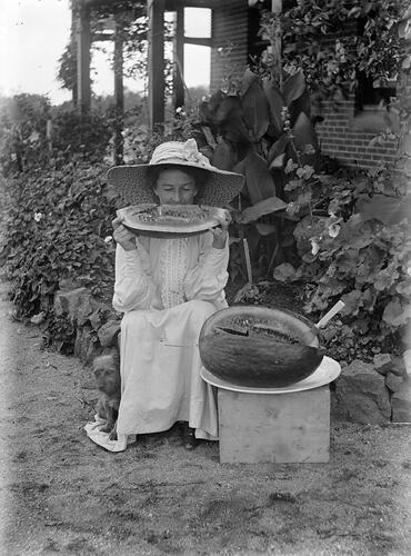Unknown woman eating a watermelon, Victoria, date unknown