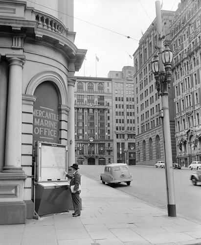 Negative - Man Looking at 'City Guide' Map, Melbourne, Victoria, Feb 1954