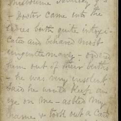 Open diary with handwritten text on discoloured worn page.