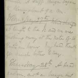 Open diary with handwritten text on discoloured worn page.