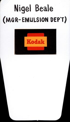 Cardboard label with Kodak logo and text.