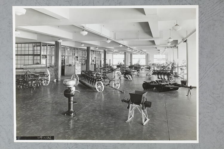 Monochrome photograph of a showroom interior.