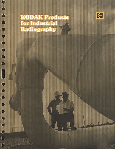 Cover with monochrome photograph of men and pipeline.
