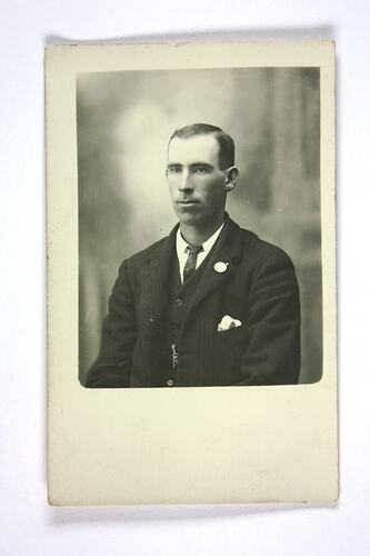 Upper body portrait of man in suit and tie.