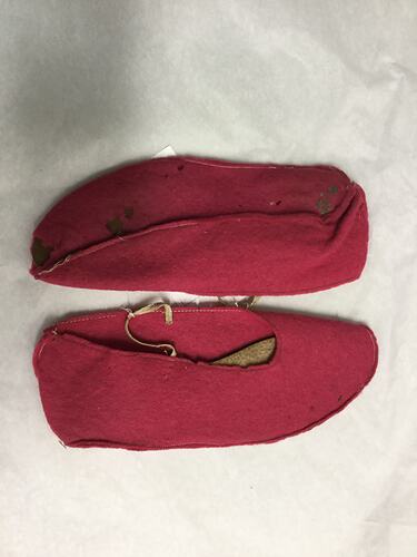 Pink felt slippers.