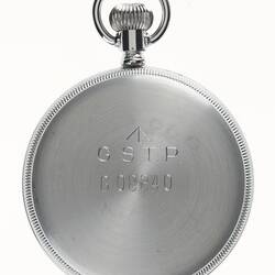 Circular watch with silver metal back, silver loop at top.