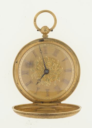 Ladies gold pocket watch, gold case. Roman numerals, black hands, ring at top.