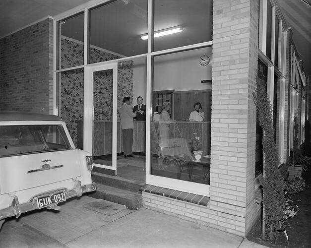 People in Motel Reception Area, Parkville, Victoria, Oct 1958