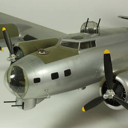 Silver model aeroplane. Detail front, nose and cockpit.