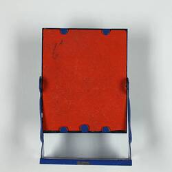 Back of toy standing mirror.