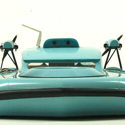 Light blue hovercraft with two propellers, rear view.