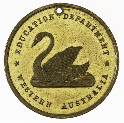 Round gold-coloured medal with swan in centre, text around edge.