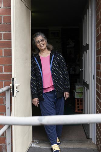 Public Housing Resident Thuy Truong Stands by her Doorway during the COVID-19 Pandemic, Richmond, Victoria, 7 May 2020