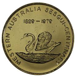 Round yellow coloured medal with swan facing left in water, text above and around edge.