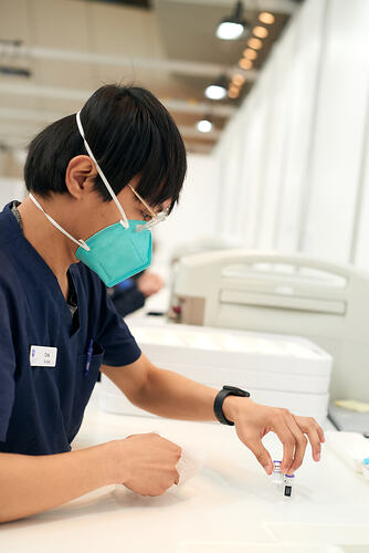 Pharmacist with Vial of Pfizer Vaccine, St Vincent's Vaccination Hub, Melbourne Museum, 23 Sep 2021