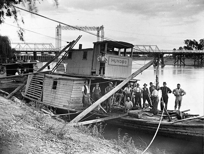 [The paddle steamer Mundoo being raised after sinking in the Murray River, Swan Hill, 1920s.]
