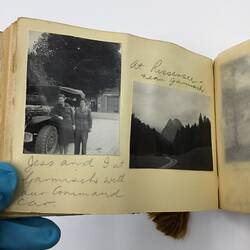 Two black and white photos glued on page of album with handwritten annotation in pencil underneath and above.
