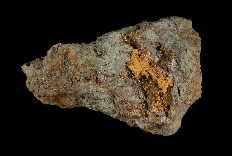 Gery rock with gold areas.