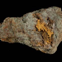 Gery rock with gold areas.