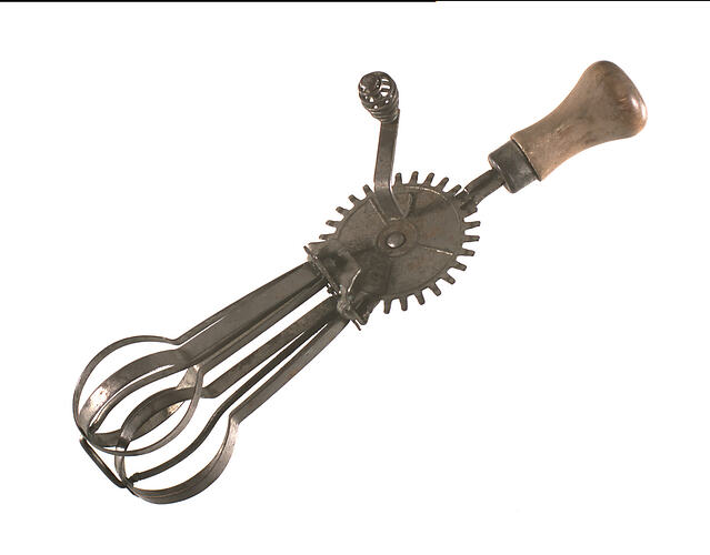Side view of hand food beater.