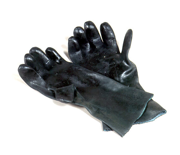 Pair of dark green gloves, hands facing up.