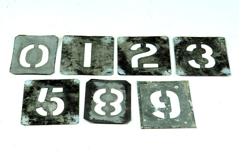 Metal stencils of numbers.