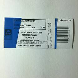 White and blue ticket with black printed text and barcode.