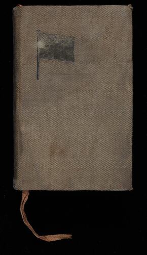 Brown cloth book front cover. Union Jack printed in gold. Pink cloth tape page marker.