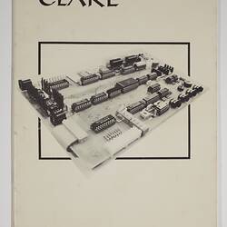 White front cover with black printed text and computer component.