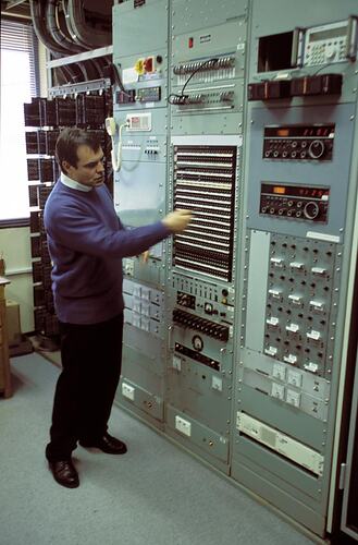 Mike Greenwood with receiver cabinets. Melbourne Coastal Radio Station, Cape Schanck, Victoria