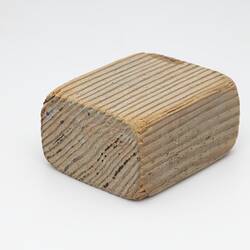 Block of pale-coloured wood.