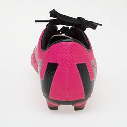 Pink Australian Rules football boot with black bootlace, lining and sole.