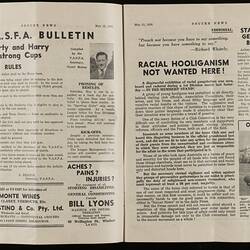 Open magazine with white pages and black printed text and images.