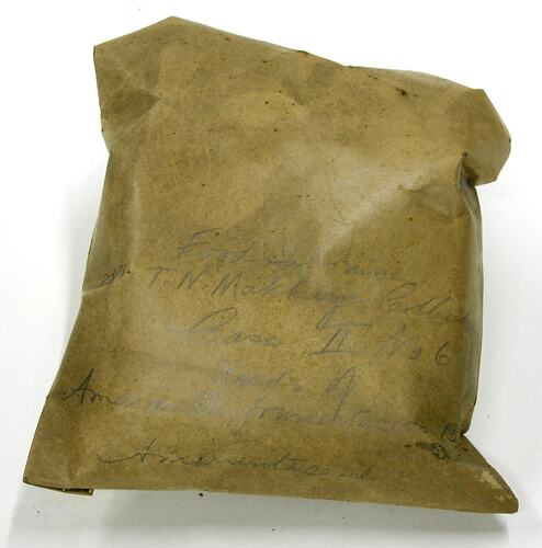 Brown paper bag with writing on front