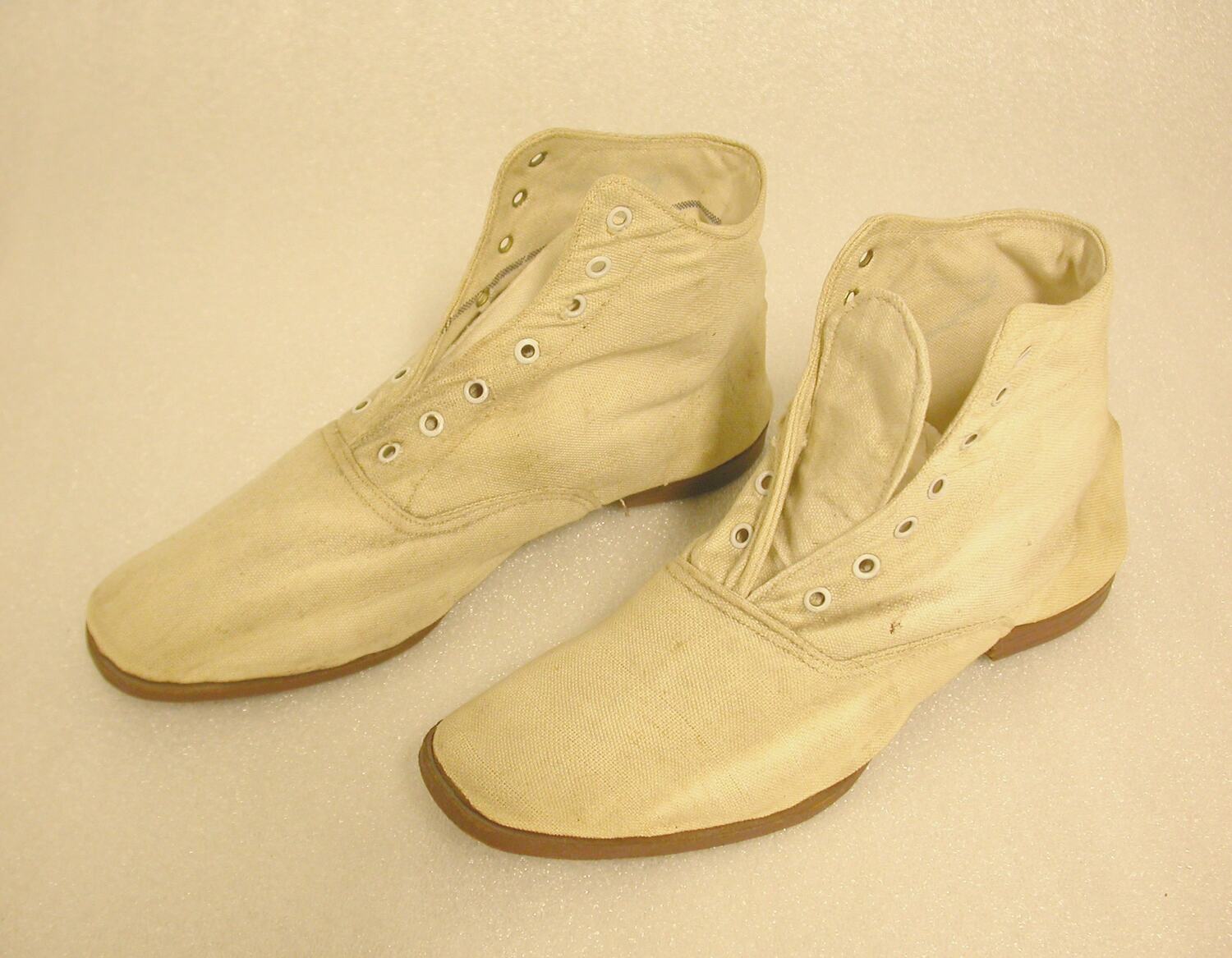 cream colored canvas shoes