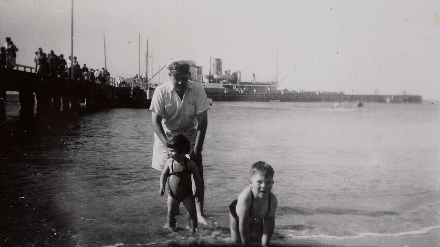 Digital Photograph - Chief Engineer of 'SS Rip', in Uniform, Playing with Son & Daughter, Frankston Beach, circa 1956