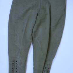 Khaki breeches with metal lace hols running from knee to calf.