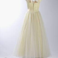 Full length cream evening gown, yellow sequins.