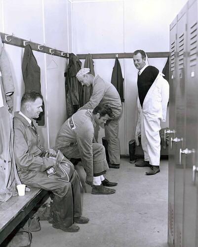 Men in locker change room.