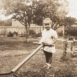 Digital Photograph - 'I'm a great help to daddy ...' Child Attempting to Mow Lawn, Preston East, 1944-1945